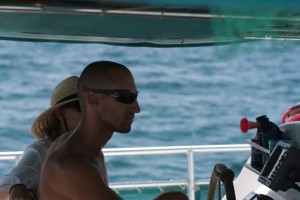 Miguel, first mate, at the helm